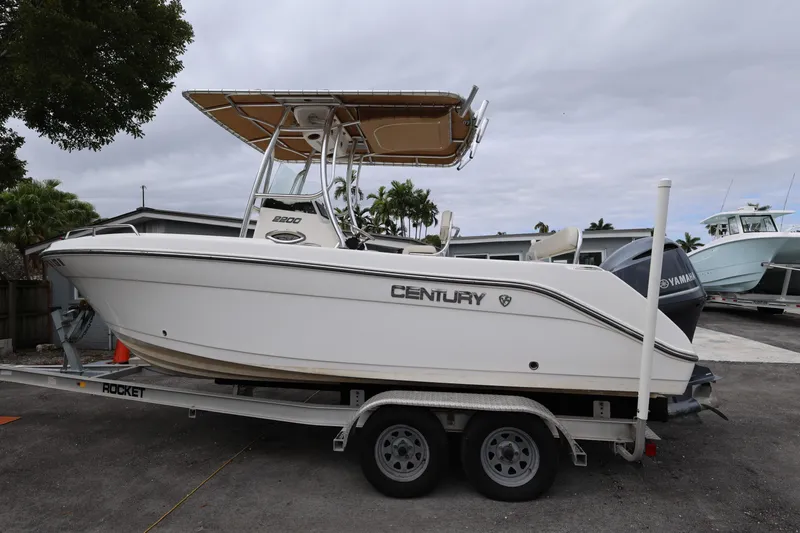 Slide: The Image of 2018 Century 2200 Center Console boat on trailer, parked outdoors. - 3