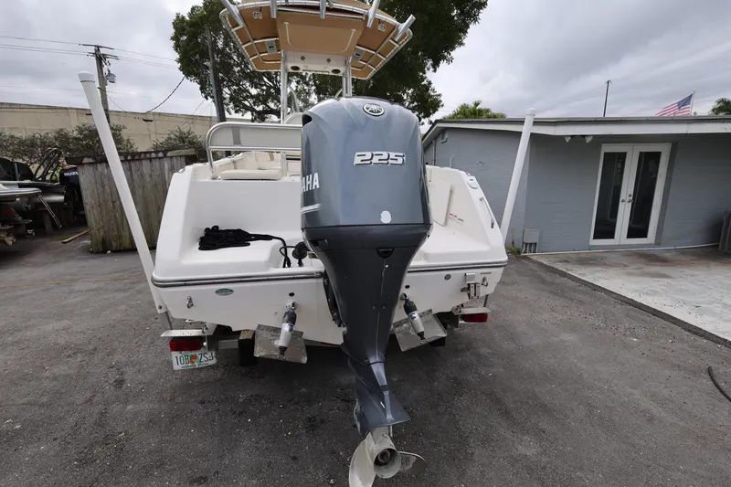 Slide: The Image of 2018 Century 2200 Center Console boat with Yamaha 225 engine, parked outdoors. - 5