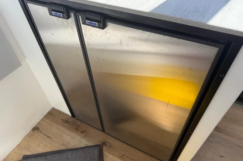 Slide: The Image of Stainless steel fridge in a 2023 Schionning 1850 S yacht interior. - 17