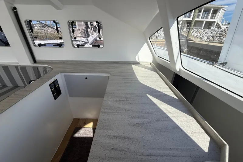 Slide: The Image of Modern interior of 2023 Schionning 1850 S catamaran with sleek countertops and large windows. - 18
