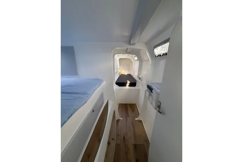 Slide: The Image of Interior of 2023 Schionning 1850 S yacht, featuring modern design and wooden flooring. - 19