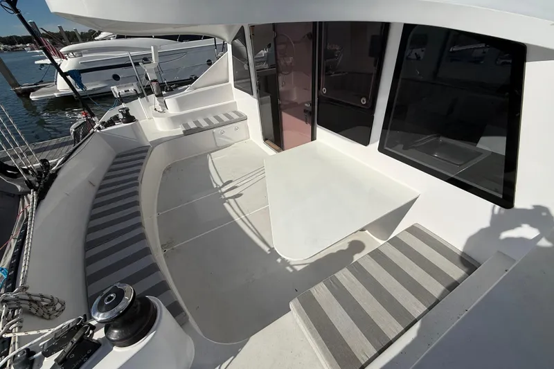 Slide: The Image of 2023 Schionning 1850 S yacht deck with striped seating and modern design. - 30