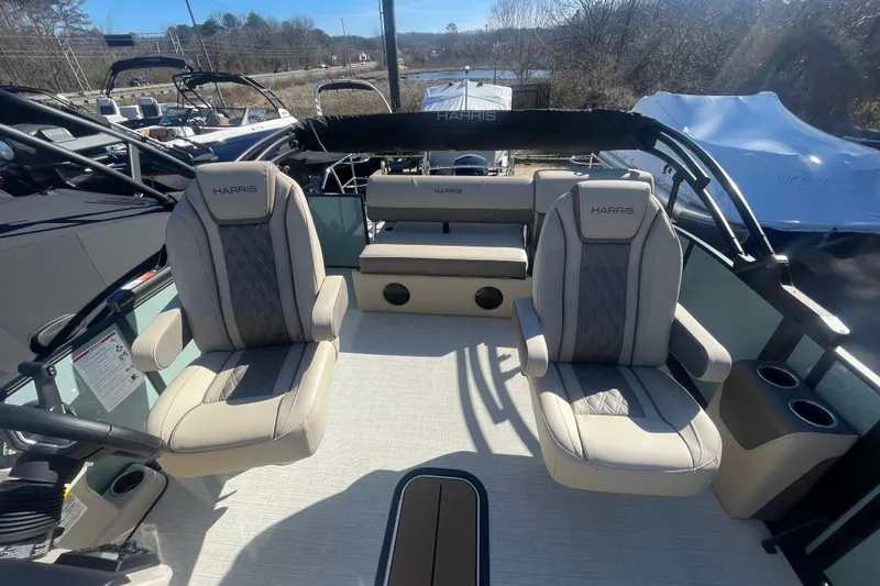 Slide: The Image of 2026 Harris Cruiser 210 boat interior with plush seating and modern design. - 9