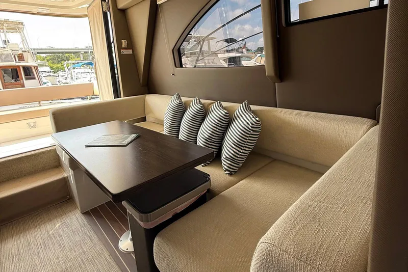 Slide: The Image of Luxurious interior of 2013 Carver C34 yacht with cozy seating and striped pillows. - 10