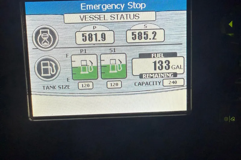Slide: The Image of Carver C34 2013 vessel status display showing fuel levels and emergency stop. - 25