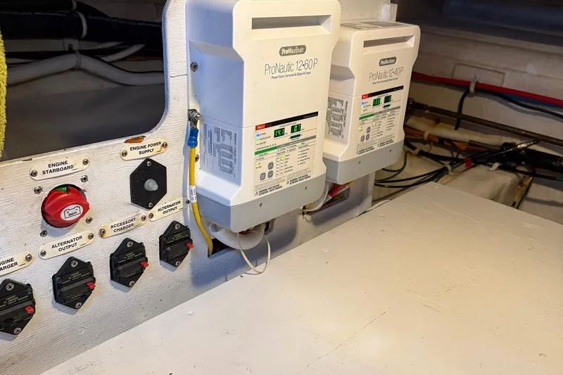Slide: The Image of Electrical panel and chargers in 2013 Carver C34 boat engine room. - 37