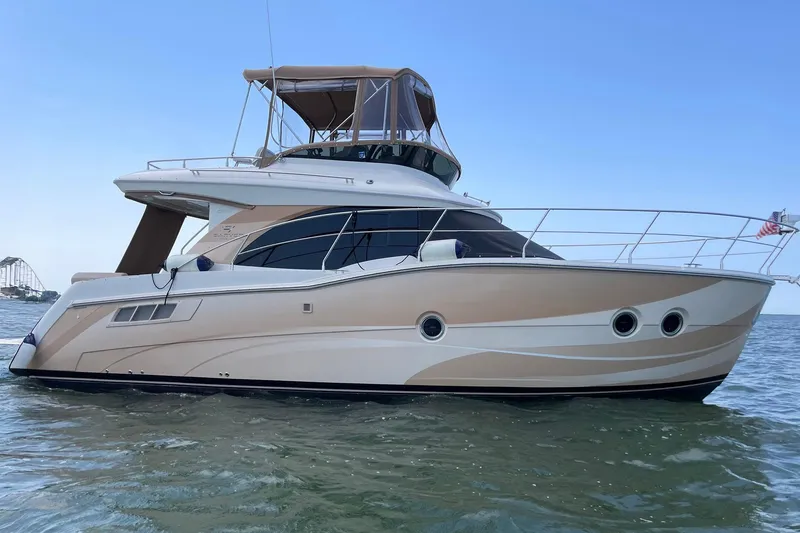 The Image of 2013 Carver C34 yacht on water, featuring sleek design and modern amenities. - 1