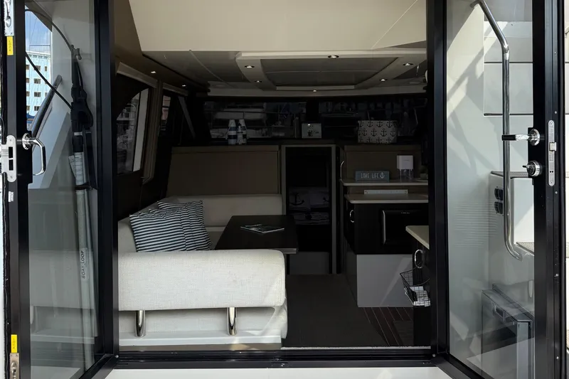 Slide: The Image of Interior view of 2013 Carver C34 yacht, featuring modern seating and decor. - 6