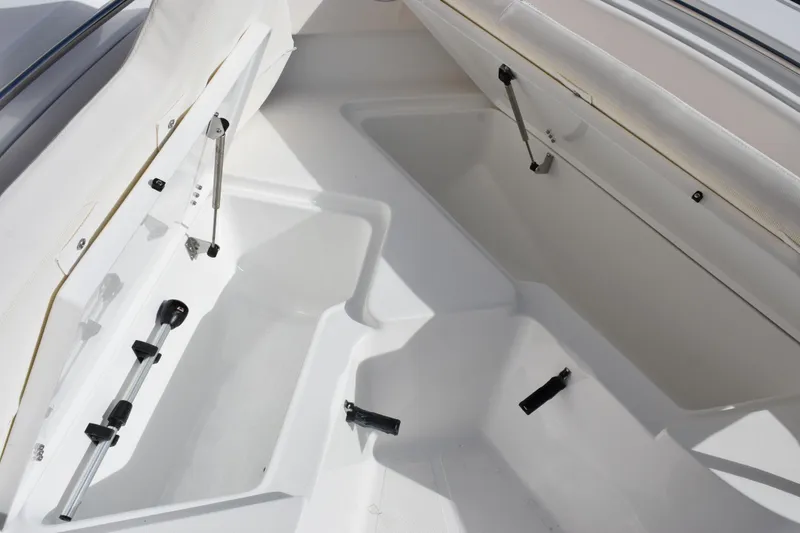 Slide: The Image of Interior storage compartments of 2026 Sea Hunt Ultra 219 boat, featuring hydraulic supports. - 13