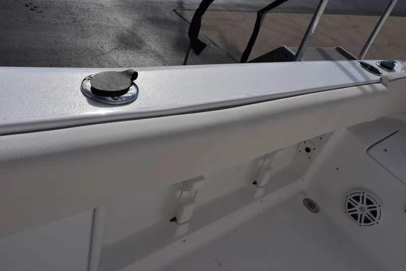 Slide: The Image of 2026 Sea Hunt Ultra 219 boat interior with sleek white finish and deck features. - 14