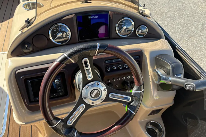 Slide: The Image of Steering console of 2019 South Bay 525 RS 3.0 Arch boat with gauges and controls. - 10