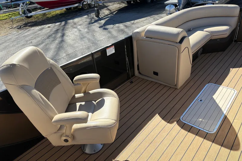 Slide: The Image of 2019 South Bay 525 RS 3.0 Arch boat interior with beige seating and wood flooring. - 6