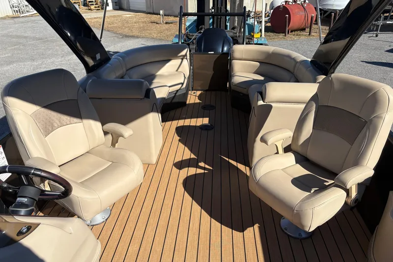 Slide: The Image of 2019 South Bay 525 RS 3.0 Arch boat interior with beige seating and wood flooring. - 7