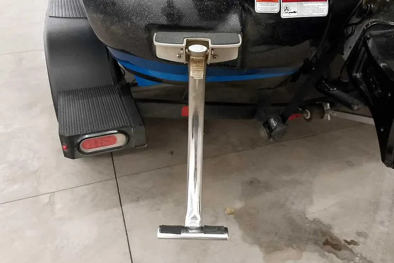 Slide: The Image of Rear view of a 2022 Nitro Z20 boat trailer with a metal support stand. - 10