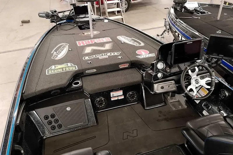 Slide: The Image of 2022 Nitro Z20 boat interior with steering wheel, control panel, and branded decals. - 16
