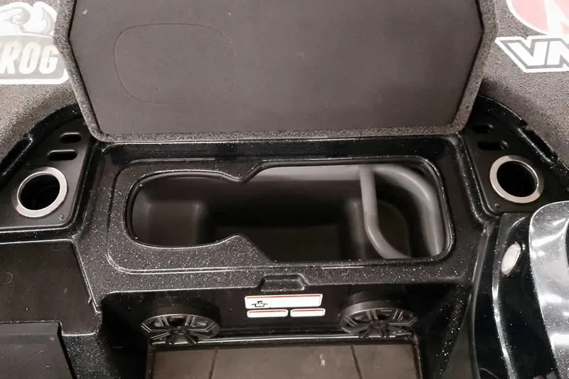 Slide: The Image of 2022 Nitro Z20 boat storage compartment with cup holders and speaker. - 17