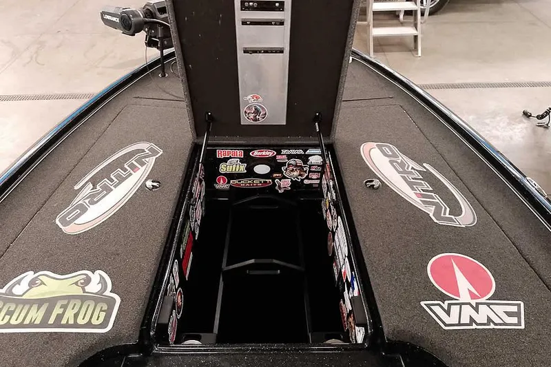 Slide: The Image of 2022 Nitro Z20 boat interior with storage compartment and various brand stickers. - 18