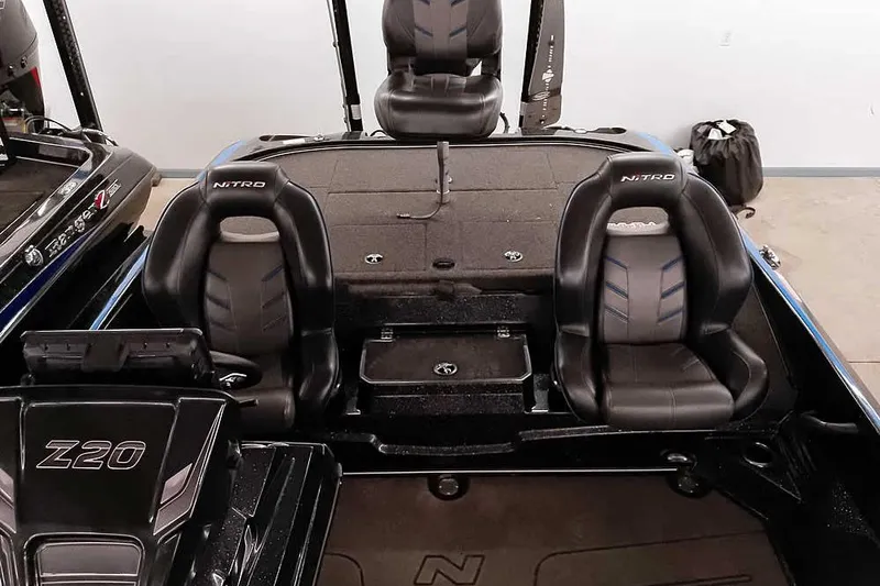 Slide: The Image of 2022 Nitro Z20 boat interior with black seats and dashboard. - 25