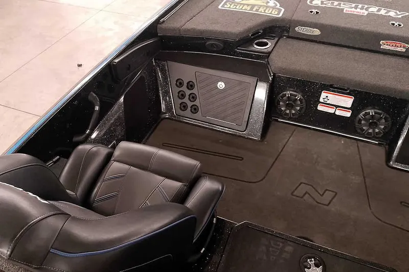 Slide: The Image of 2022 Nitro Z20 boat interior with black seating and storage compartments. - 26