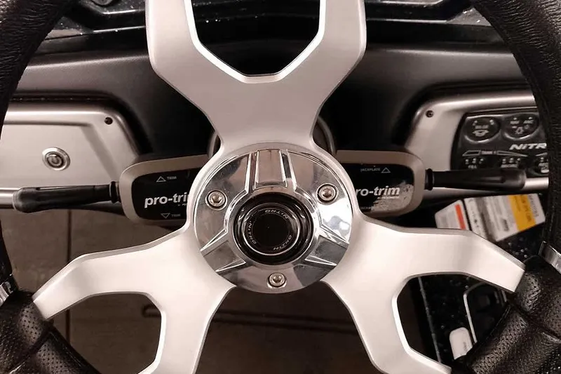 Slide: The Image of Steering wheel of 2022 Nitro Z20 boat with pro-trim controls. - 28