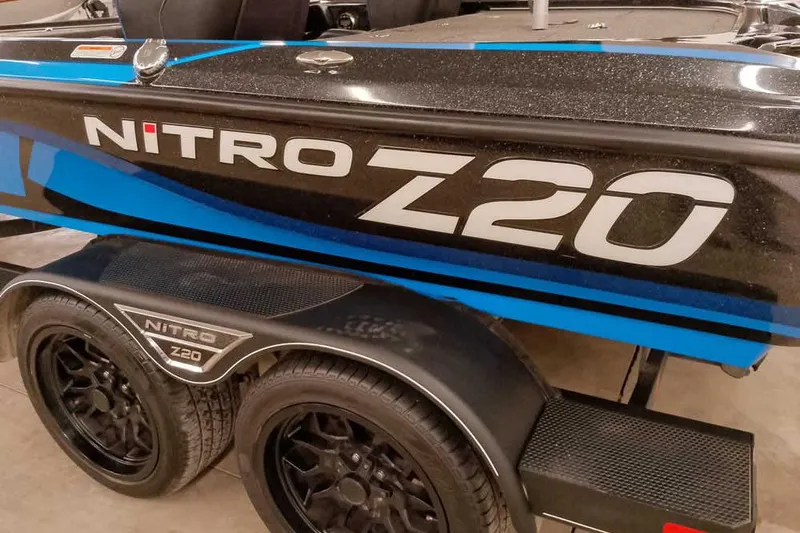 Slide: The Image of 2022 Nitro Z20 boat with blue and black design on trailer. - 3
