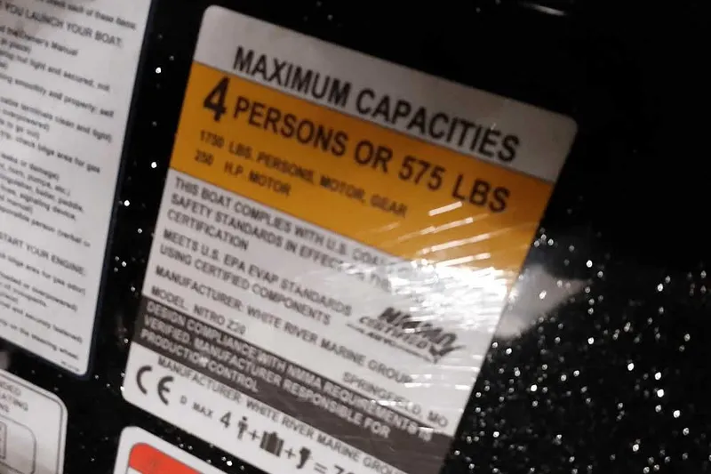 Slide: The Image of Boat capacity label for Nitro Z20, 2022 model, showing maximum 4 persons or 575 lbs. - 30