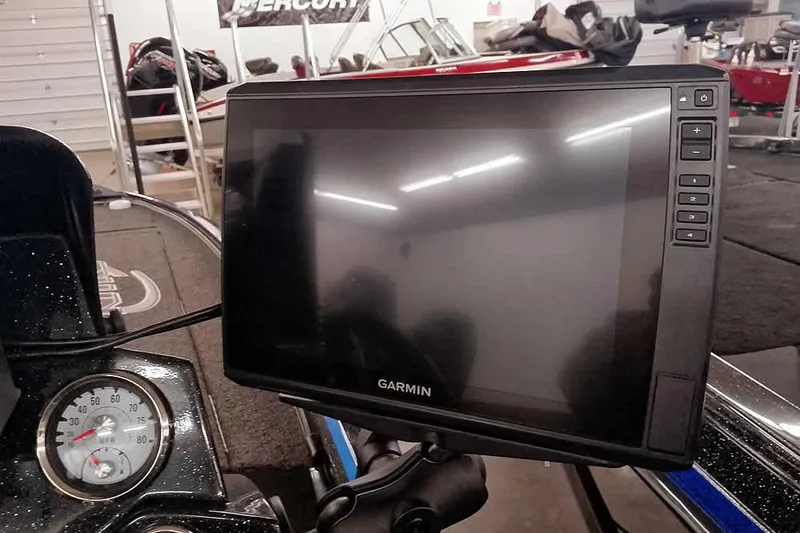 Slide: The Image of Garmin display on 2022 Nitro Z20 boat dashboard in showroom setting. - 33