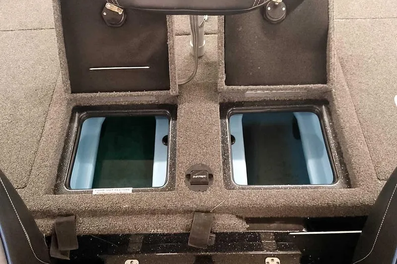 Slide: The Image of 2022 Nitro Z20 boat storage compartments with open lids, showcasing interior space. - 35