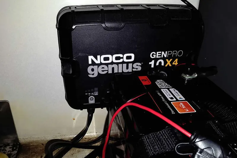 Slide: The Image of NOCO Genius GENPRO 10X4 charger connected to a battery in a 2022 Nitro Z20. - 37