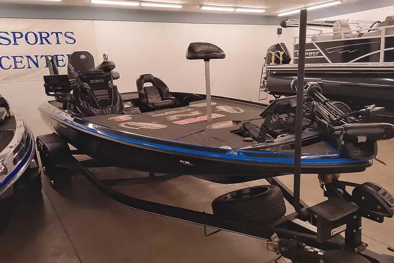 Slide: The Image of 2022 Nitro Z20 boat displayed indoors at a sports center. - 40