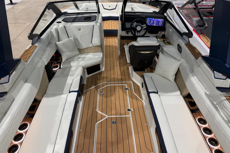 Slide: The Image of Luxurious interior of 2026 Nautique Super Air Nautique G25 boat with plush seating and modern dashboard. - 10