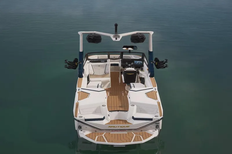 Slide: The Image of 2026 Nautique Super Air Nautique G25 boat on calm water, showcasing sleek design. - 15