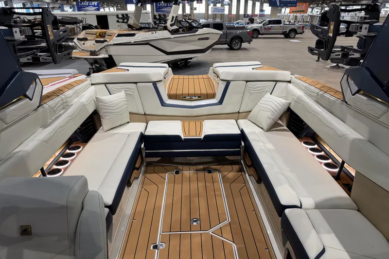 Slide: The Image of Luxurious interior of 2026 Nautique Super Air Nautique G25 boat with elegant seating and wood accents. - 7