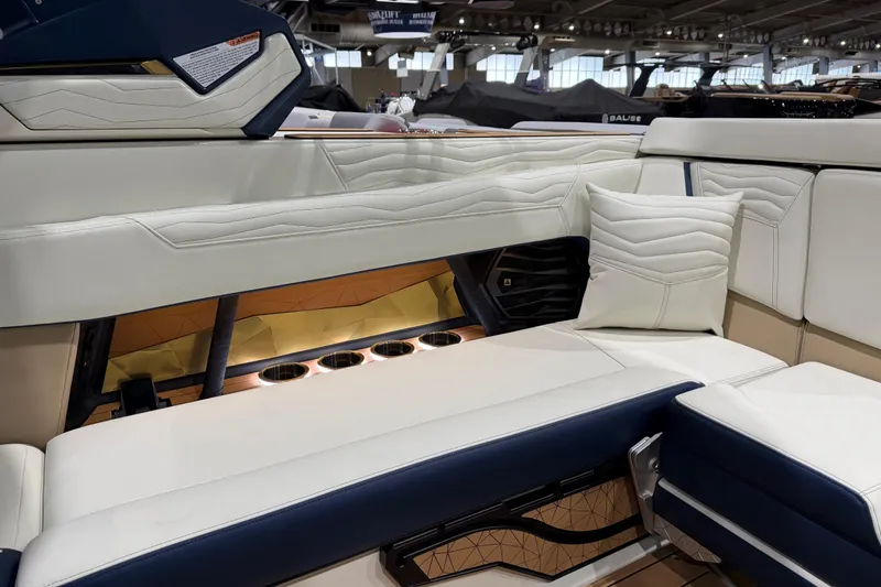 Slide: The Image of Luxurious interior of 2026 Nautique Super Air Nautique G25 with plush seating and cup holders. - 8