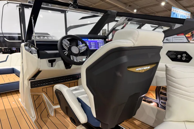 Slide: The Image of 2026 Nautique Super Air Nautique G25 interior with modern dashboard and luxurious seating. - 9