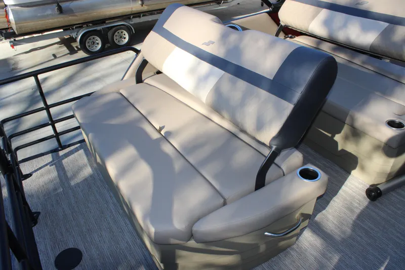 Slide: The Image of 2026 Starcraft EXS 3 DL boat seating with cup holders and sleek design. - 17