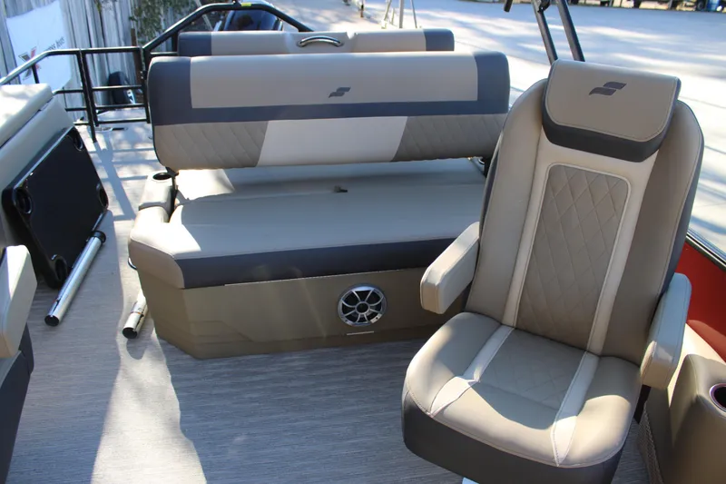 Slide: The Image of 2026 Starcraft EXS 3 DL boat interior with beige and gray seating, featuring quilted design. - 18