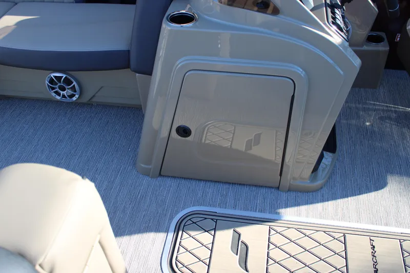 Slide: The Image of 2026 Starcraft EXS 3 DL boat interior with seating and storage compartment. - 28
