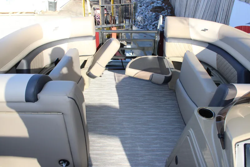 Slide: The Image of 2026 Starcraft EXS 3 DL boat interior with beige seating and modern design. - 32