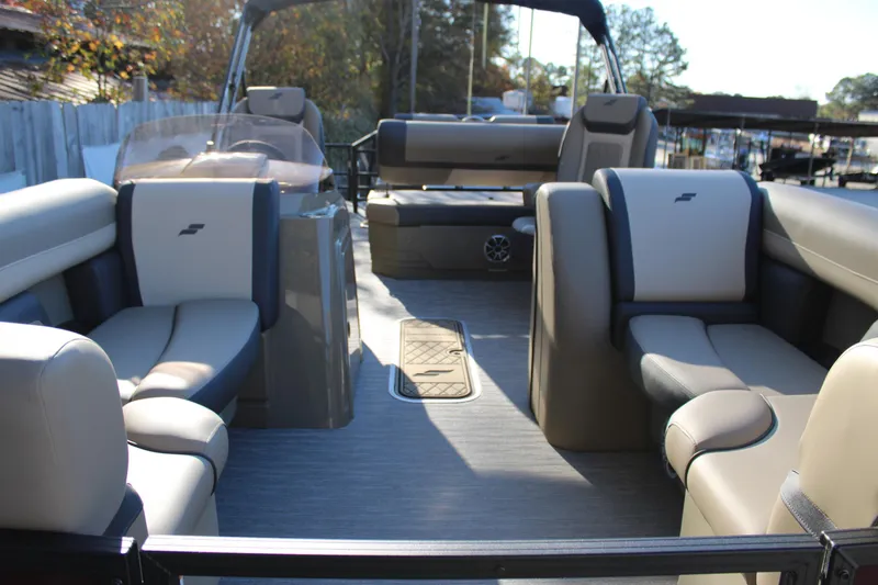 Slide: The Image of 2026 Starcraft EXS 3 DL pontoon boat interior with beige and gray seating. - 34