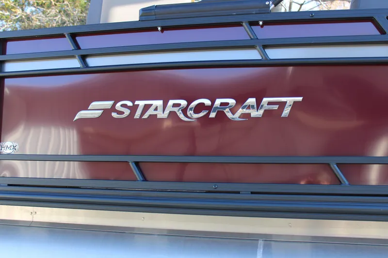 Slide: The Image of 2026 Starcraft EXS 3 DL boat logo on maroon panel. - 4