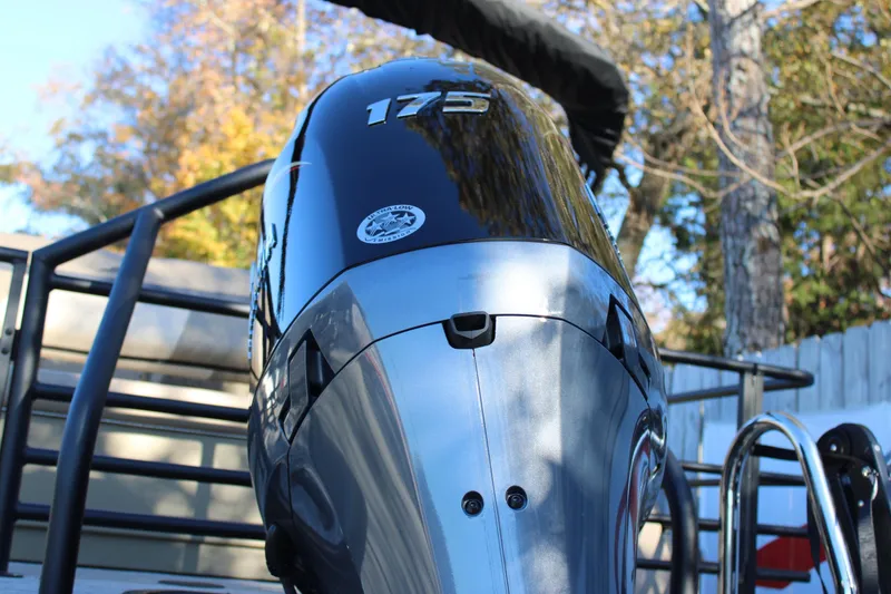 Slide: The Image of Outboard motor on a 2026 Starcraft EXS 3 DL boat, close-up view. - 6