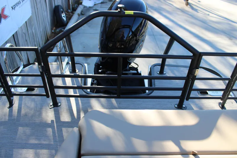 Slide: The Image of 2026 Starcraft EXS 3 DL boat with rear railing and outboard motor. - 8