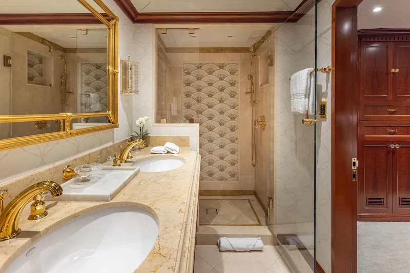 Slide: The Image of Luxurious bathroom on 2001 TRINITY Tri-Deck MY yacht with marble countertops and gold fixtures. - 15