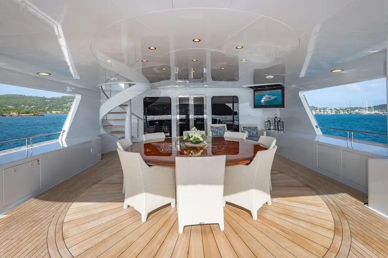 Slide: The Image of Luxurious 2001 TRINITY Tri-Deck MY yacht deck with elegant dining area and ocean view. - 26