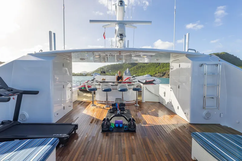 Slide: The Image of Luxurious 2001 TRINITY Tri-Deck MY yacht deck with bar stools and scenic ocean view. - 31