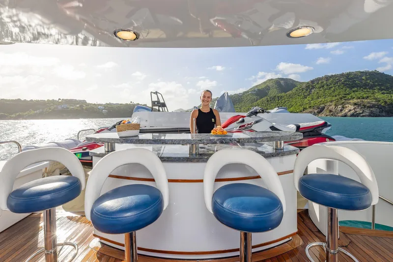 Slide: The Image of Luxury yacht deck with bar, stools, and scenic ocean view; TRINITY Tri-Deck MY 2001. - 32