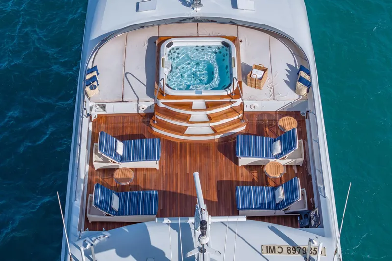 Slide: The Image of Luxurious 2001 TRINITY Tri-Deck MY yacht deck with jacuzzi and sun loungers. - 36