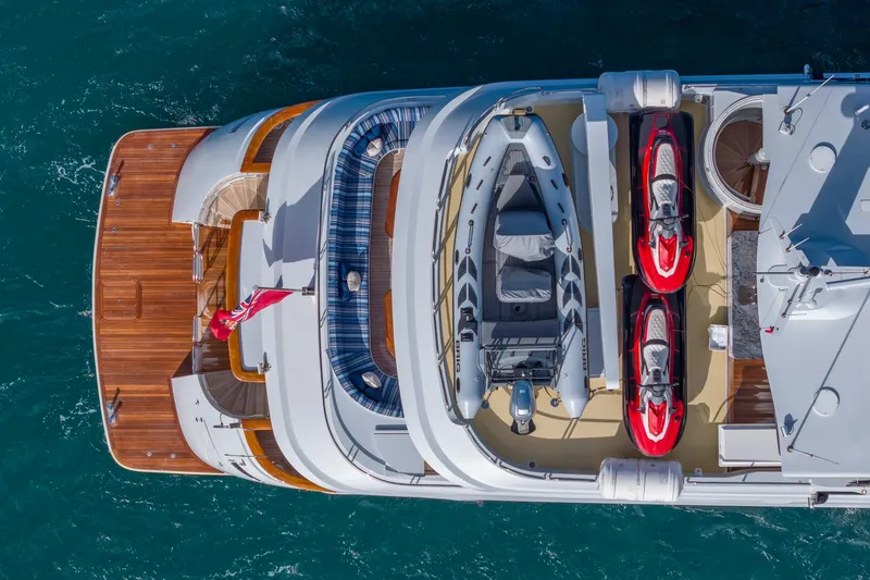 Slide: The Image of Aerial view of 2001 TRINITY Tri-Deck MY yacht with jet skis and tender. - 45