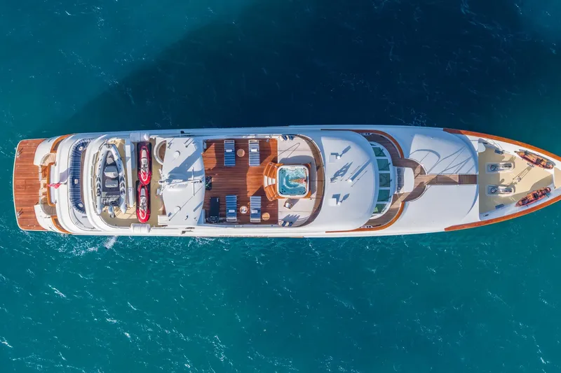 Slide: The Image of Aerial view of 2001 TRINITY Tri-Deck MY yacht on blue ocean water. - 49